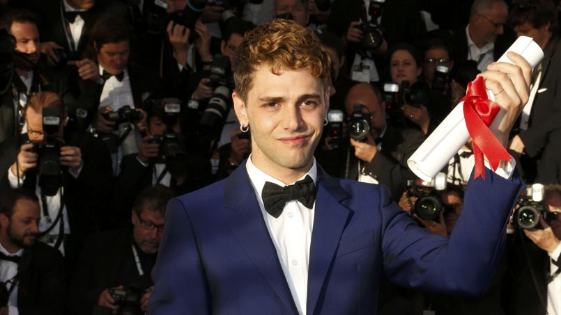Director Xavier Dolan, Jury Prize award winner for his film "Mommy", poses during a photocall at the closing ceremony of the 67th Cannes Film Festival in Cannes